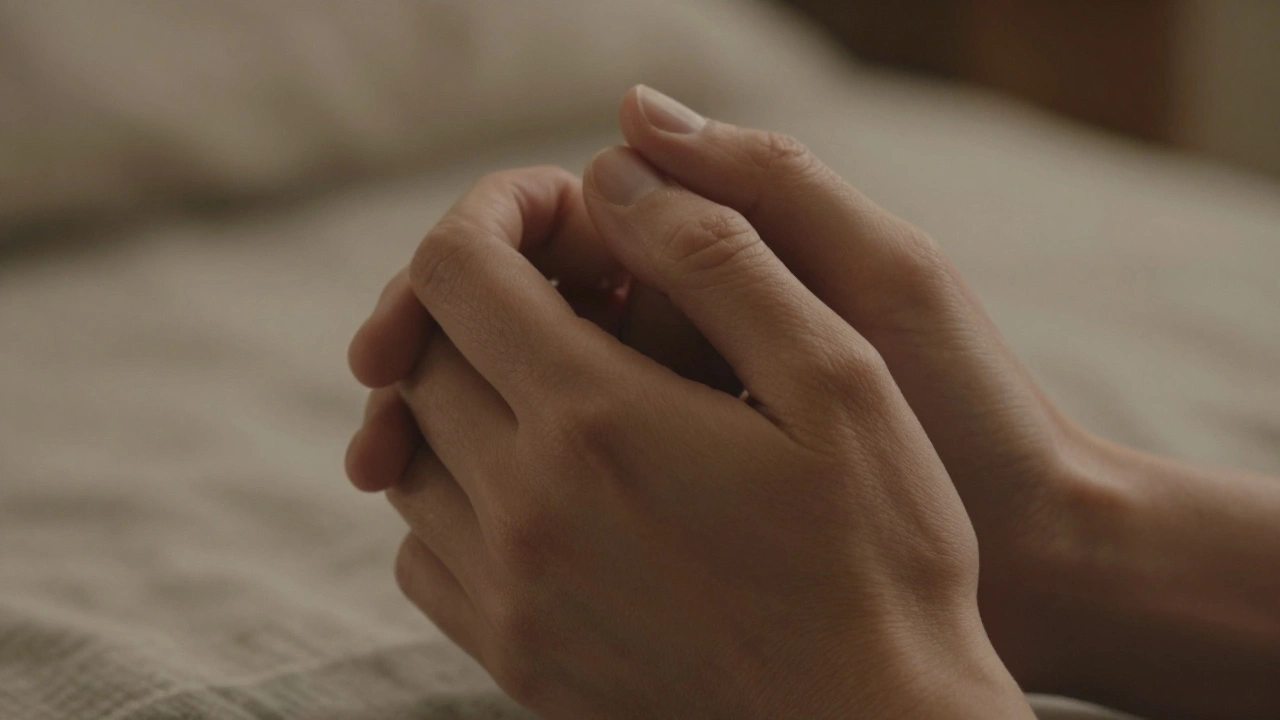 Two hands gently holding each other, no faces visible, conveying quiet connection.
