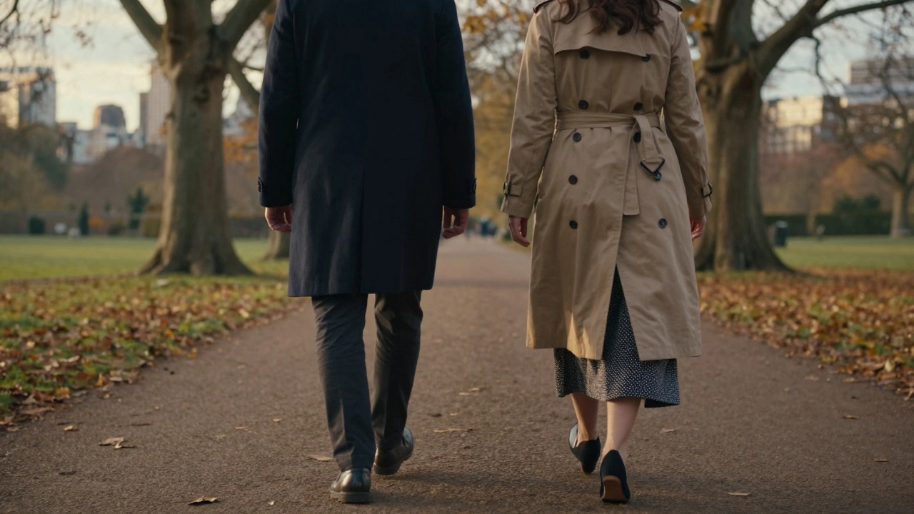 Two people walking together in Hyde Park at sunset, backs turned, no faces shown.