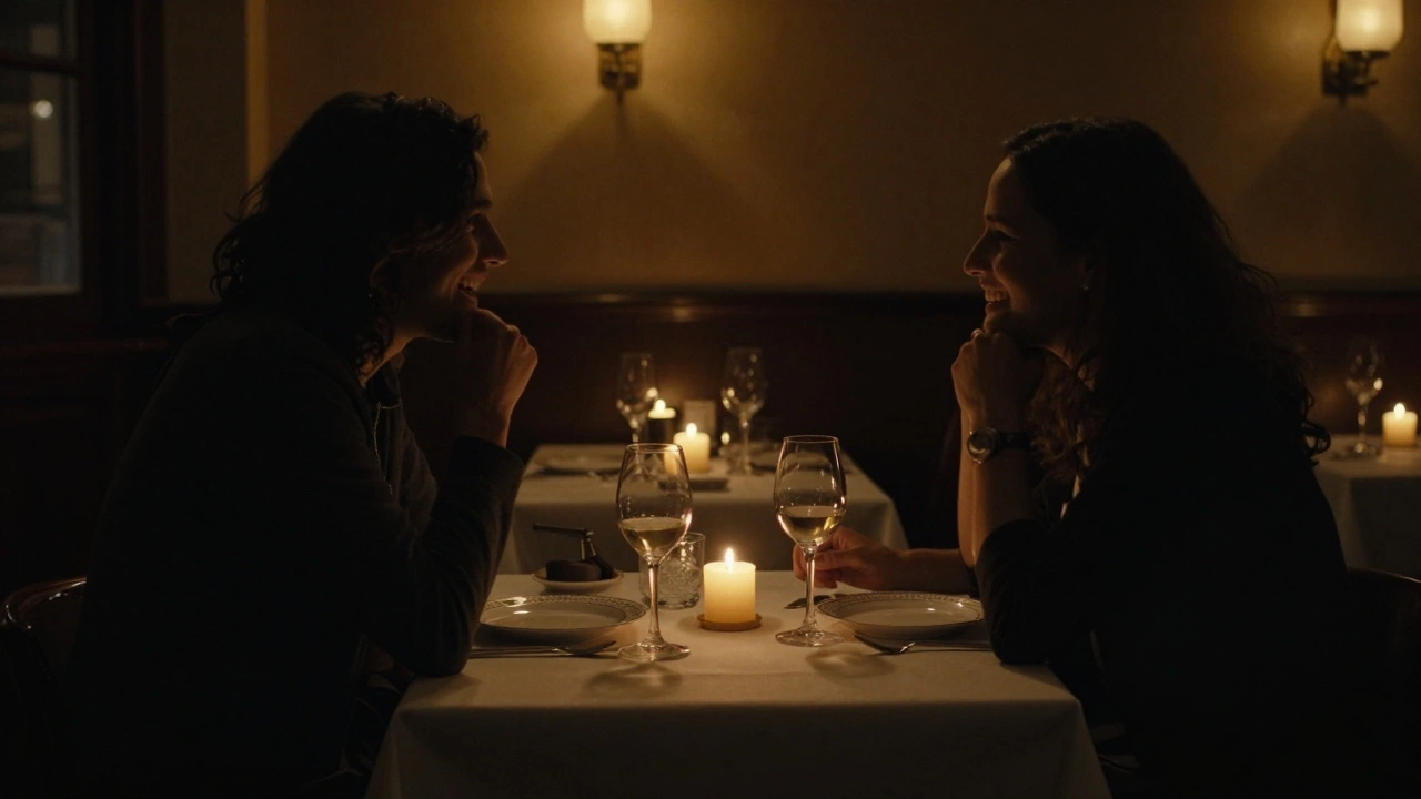 Two people enjoying dinner in a cozy restaurant, lit by candlelight.